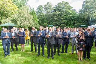 The guests of the reception in the garden of the Ambassador's residence