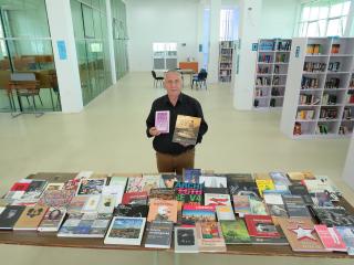 Ambassador Pavel Mikeš donating books