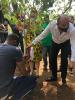 Ambassador Skolil planting a tree
