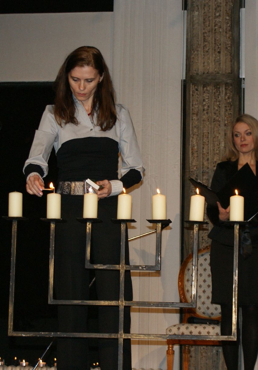 Mrs Zantovska lights a candle