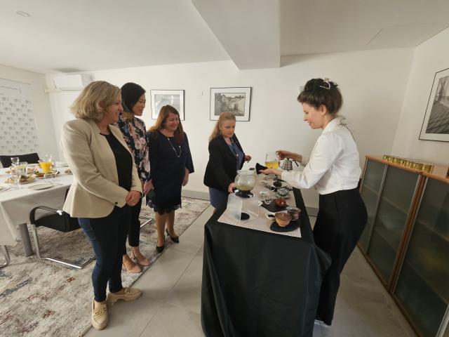 Lucie Vaňová demonstrating the correct preparation of specialty teas for guests. 