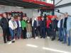 Celá delegace během návštěvy showroomu Zetor / Вся делегация во время визита шоурума Zetor