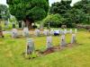 Tidying graves at the cemetery in Tain