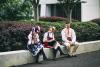 Students take a break on their latest technology in traditional national costume kroj after their performance of Czech folk dances and songs. By Czech School of Atlanta