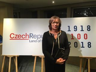 Deputy Minister of Agriculture Ms. V. Šedivá standing with the logo of 100 anniversary of Czech Republic founding during Festival