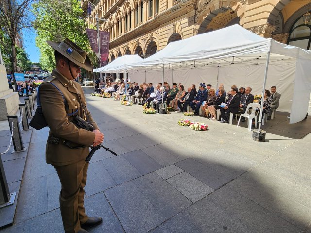 Member of the guard of honour and esteemed guests during the commemorative ceremony. 