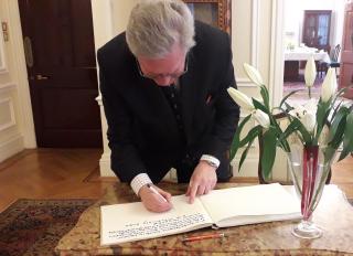 Charles Hay, 16th Earl of Kinnoull is signing the book of visits at the Residence of the Czech Ambassador in London