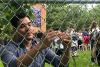 Visitor symbolically hangs a key in tribute to the Velvet Revolution. Photo credit: Andrea Pohl 